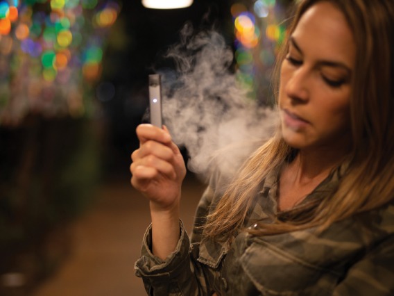 A girl smoking an e-cig