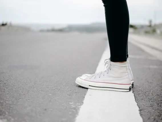 Person standing beside the road