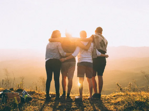 4 people on a mountain top