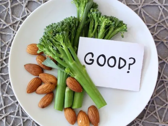 Food on a plate with a paper saying "good?"