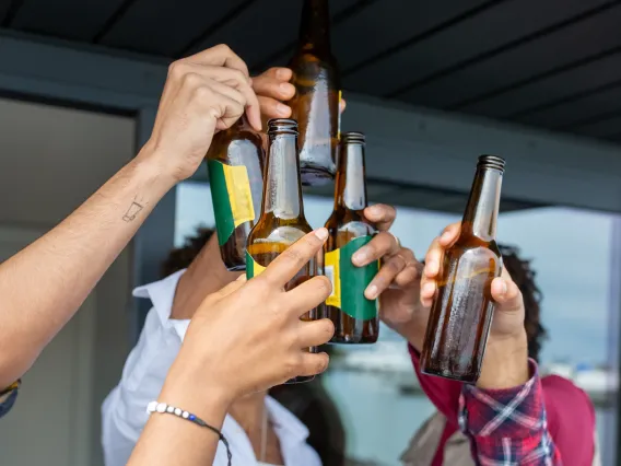 Group of people toasting with beers