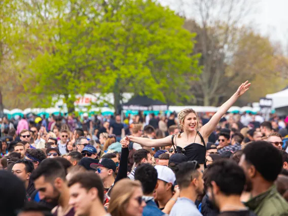 Large crowd of people at a festival outdoors