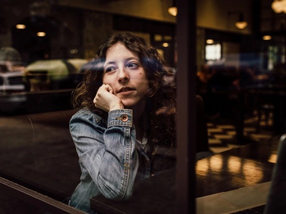 Person looking outside a window 