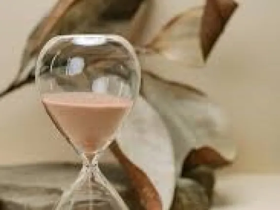 Beach sand clear hour glass