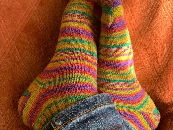 view of someone's feet while wearing colorful socks