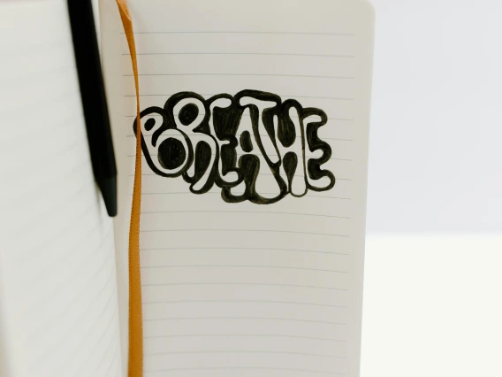 the word "breathe" illustrated in a notebook