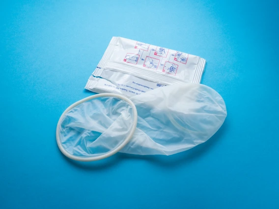 internal condom next to packaging 