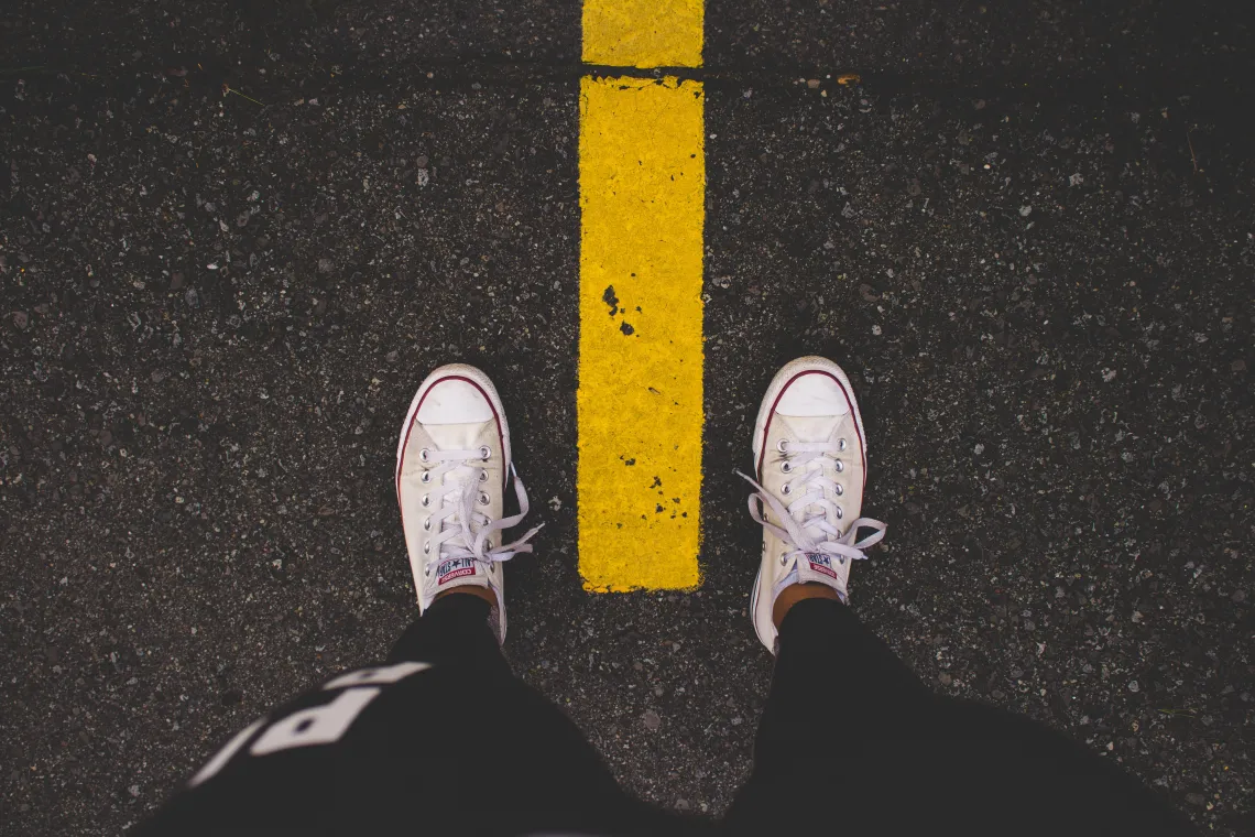 Person with shoes on the road