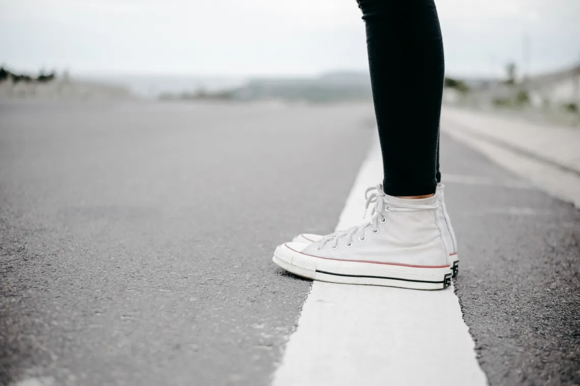 Person standing beside the road