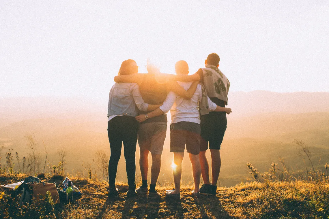 4 people on a mountain top