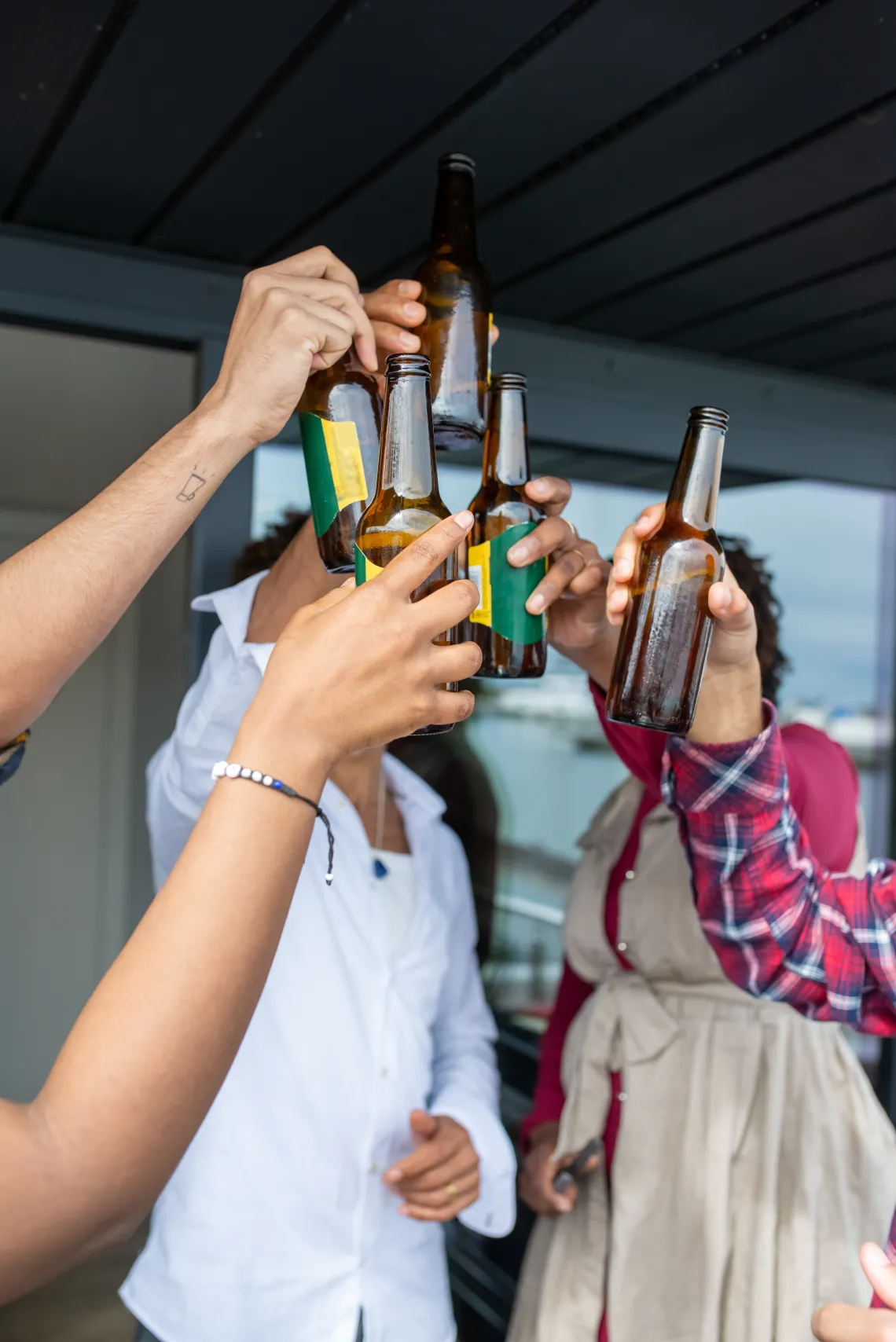 Group of people toasting with beers