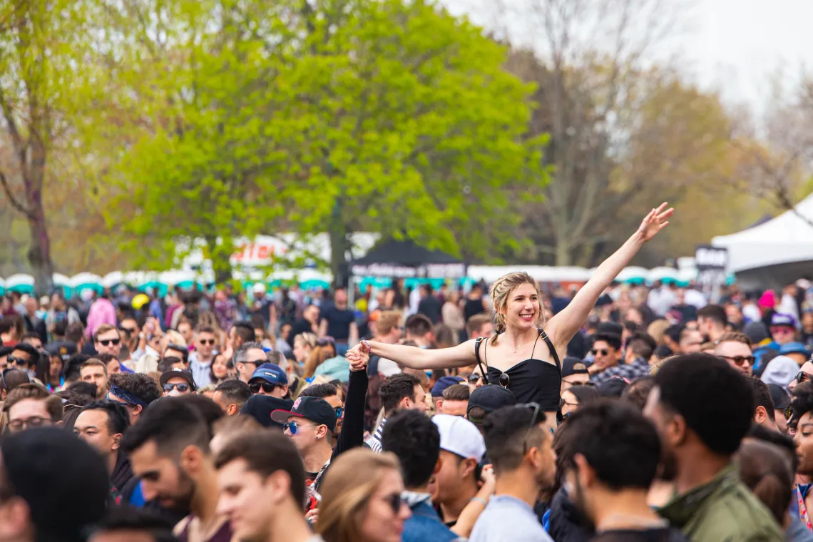 Large crowd of people at a festival outdoors