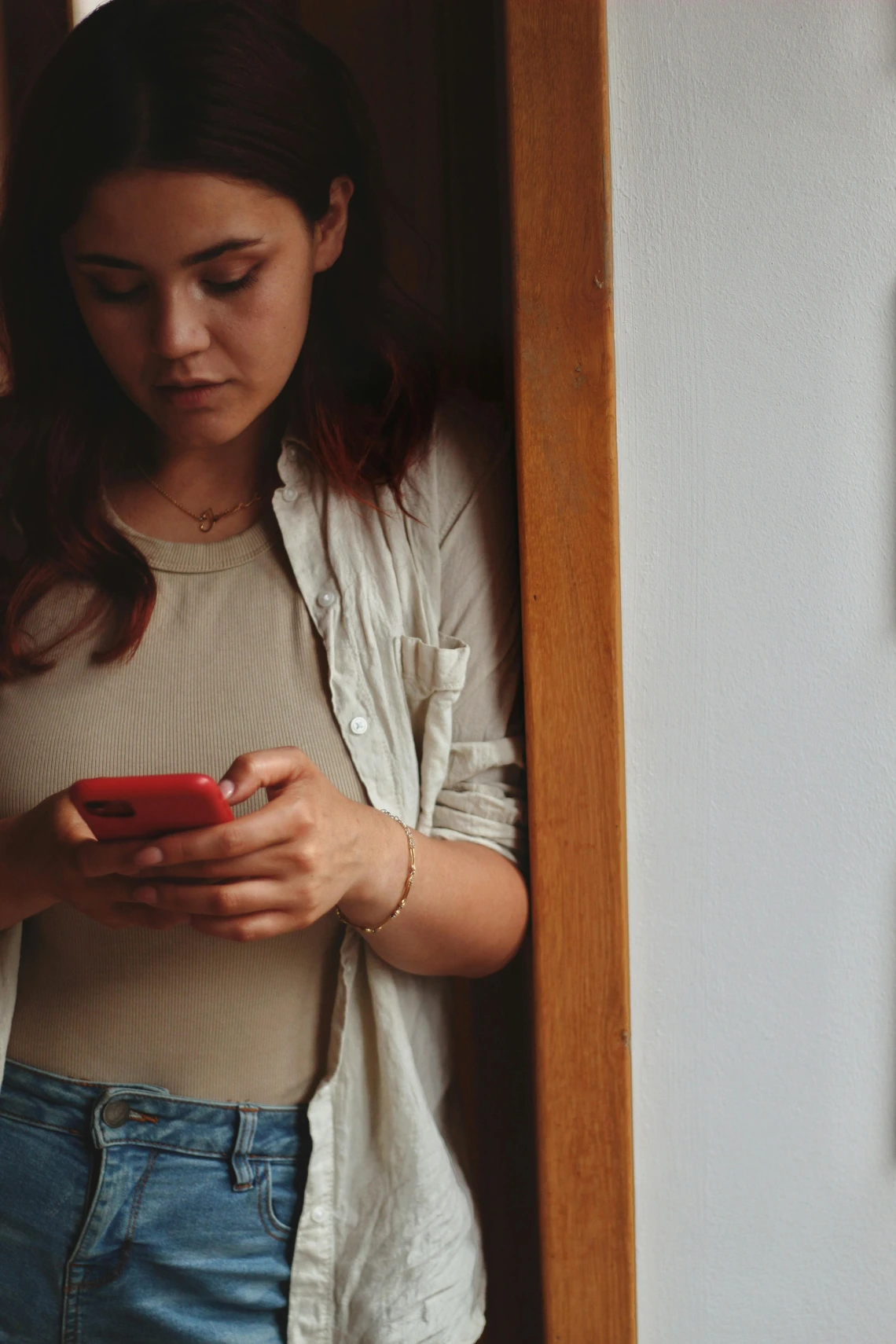 person holding phone dialing